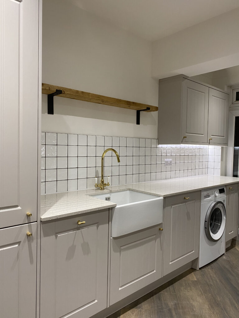 Professional kitchen installation in Totteridge featuring a shaker kitchen and a belfast sink as the main focal points.