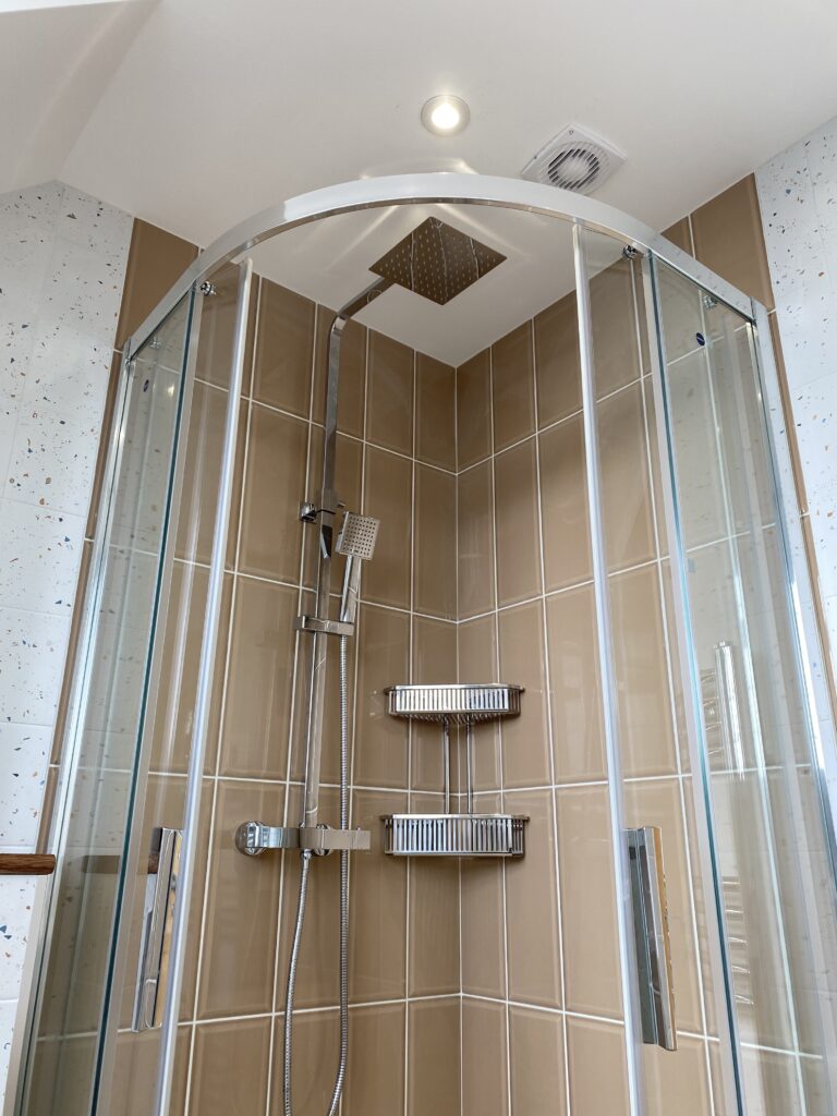 Professional bathroom installation in Arkley featuring a quadrant shower and a metro tiles as the main focal points