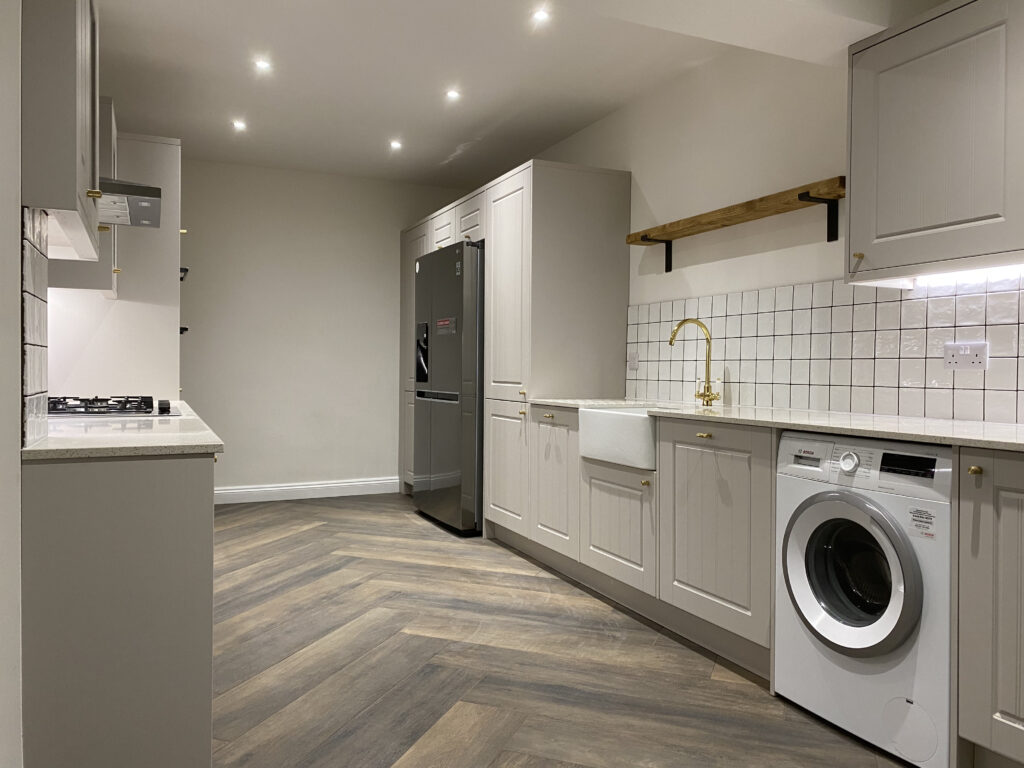 Professional kitchen installation in Totteridge featuring a luxury kitchen and a washing machine as the main focal points