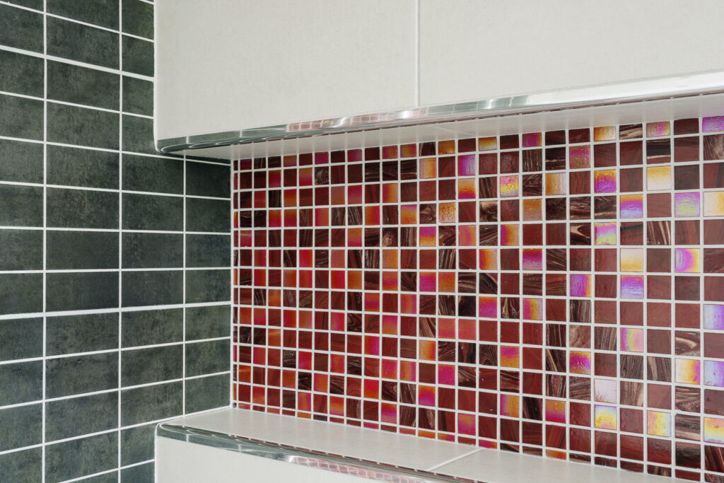 Professional bathroom installation in Mill Hill featuring a shower niche and a mosaic tiles as the main focal points