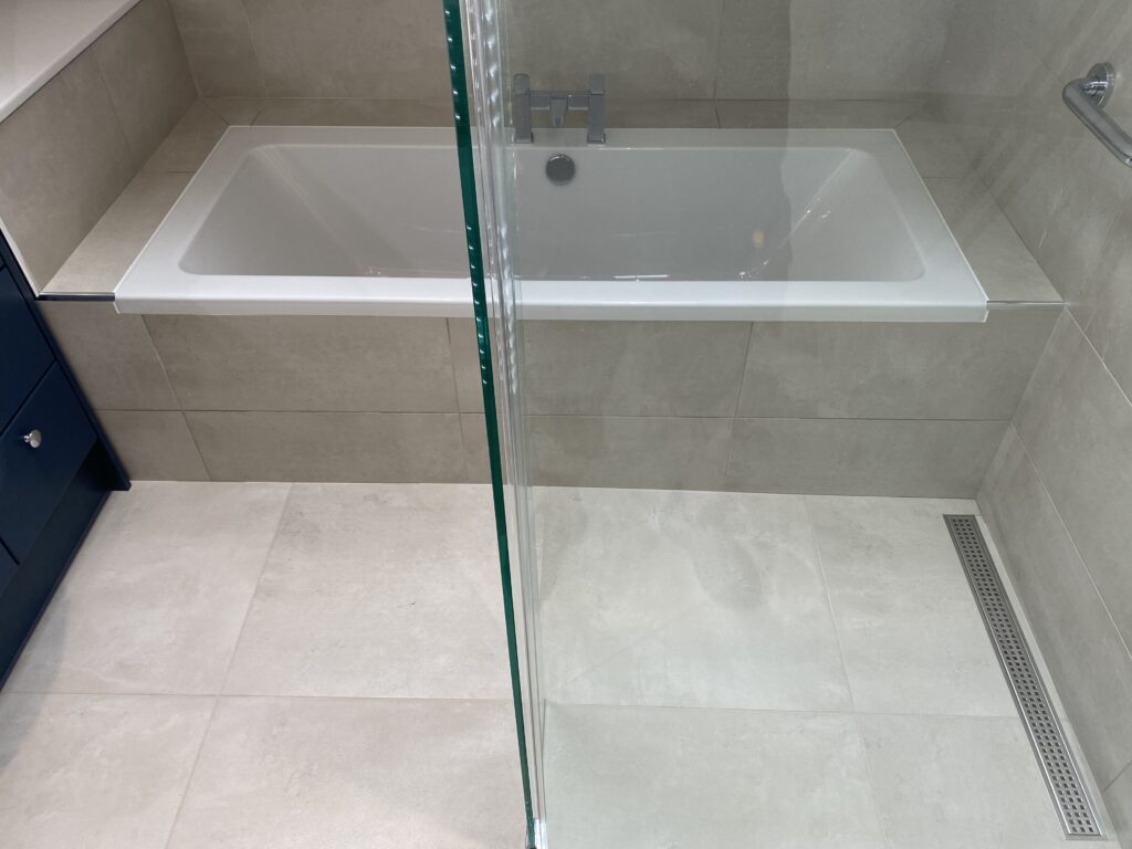 Professional wet room installation in Totteridge featuring a double ended bath and a wet room as the main focal points