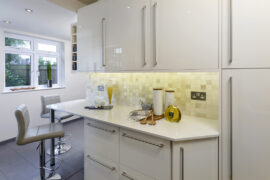 Professional kitchen installation in Arkley featuring a kitchen extension and a high gloss kitchen as the main focal points. The design is completed with a quartz worktop and a black floor tiles for a cohesive modern finish. Project completed by A Martens Kitchens & Bathrooms Ltd. For a free quote, visit https://amartens.co.uk to discuss your kitchen renovation. Professional kitchen installation in Arkley featuring a kitchen extension and a high gloss kitchen as the main focal points.