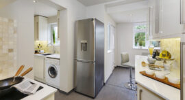 Professional kitchen installation in Arkley featuring a free standing fridge and a kitchen extension as the main focal points. The design is completed with a high gloss kitchen and a quartz worktop for a cohesive modern finish. Project completed by A Martens Kitchens & Bathrooms Ltd. For a free quote, visit https://amartens.co.uk to discuss your kitchen renovation. Professional kitchen installation in Arkley featuring a free standing fridge and a kitchen extension as the main focal points.