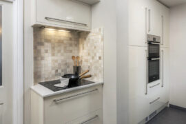 Professional kitchen installation in Arkley featuring a double oven and a mosaic tiles as the main focal points. The design is completed with an electric hob and an integrated chimney hood for a cohesive modern finish. Project completed by A Martens Kitchens & Bathrooms Ltd. For a free quote, visit https://amartens.co.uk to discuss your kitchen renovation. Professional kitchen installation in Arkley featuring a double oven and a mosaic tiles as the main focal points.