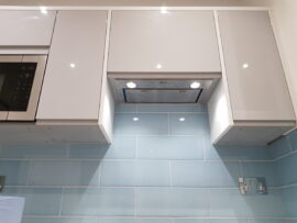 Professional kitchen installation in Mill Hill featuring an integrated hood and a blue metro tiles as the main focal points. The design is completed with a handleless kitchen for a cohesive modern finish. Project completed by A Martens Kitchens & Bathrooms Ltd. For a free quote, visit https://amartens.co.uk to discuss your kitchen renovation. Professional kitchen installation in Mill Hill featuring an integrated hood and a blue metro tiles as the main focal points