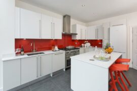 Professional kitchen installation in Hadley Wood featuring a luxury kitchen and a red glass splashback as the main focal points. The design is completed with a kitchen island and a quartz worktop for a cohesive modern finish. Project completed by A Martens Kitchens & Bathrooms Ltd. For a free quote, visit https://amartens.co.uk to discuss your kitchen renovation. Professional kitchen installation in Hadley Wood featuring a luxury kitchen and a red glass splashback as the main focal points.