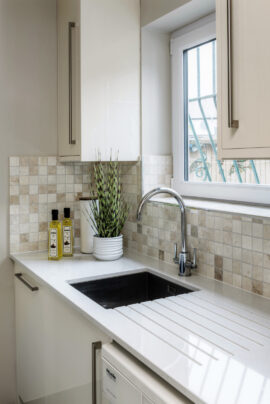 Professional kitchen installation in Arkley featuring a mosaic tiles and a quartz worktop as the main focal points. The design is completed with an under mount sink and a chrome kitchen tap for a cohesive modern finish. Project completed by A Martens Kitchens & Bathrooms Ltd. For a free quote, visit https://amartens.co.uk to discuss your kitchen renovation. Professional kitchen installation in Arkley featuring a mosaic tiles and a quartz worktop as the main focal points.