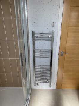Professional bathroom installation in Arkley featuring a chrome towel rail and a speckle porcelain tiles as the main focal points. The design is completed with a quadrant shower and a metro tiles for a cohesive modern finish. Project completed by A Martens Kitchens & Bathrooms Ltd. For a free quote, visit https://amartens.co.uk to discuss your bathroom renovation. Professional bathroom installation in Arkley featuring a chrome towel rail and a speckle porcelain tiles as the main focal points