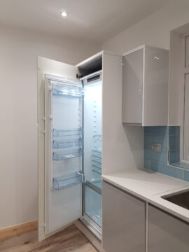 Professional kitchen installation in Mill Hill featuring an integrated fridge freezer and a handleless kitchen as the main focal points. The design is completed with a metro tiles and a corian worktop for a cohesive modern finish. Project completed by A Martens Kitchens & Bathrooms Ltd. For a free quote, visit https://amartens.co.uk to discuss your kitchen renovation. Professional kitchen installation in Mill Hill featuring an integrated fridge freezer and a handleless kitchen as the main focal points
