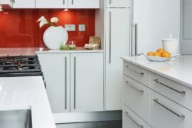 Professional kitchen installation in Hadley Wood featuring a luxury kitchen and a red glass splashback as the main focal points. The design is completed with a quartz worktop for a cohesive modern finish. Project completed by A Martens Kitchens & Bathrooms Ltd. For a free quote, visit https://amartens.co.uk to discuss your kitchen renovation. Professional kitchen installation in Hadley Wood featuring a luxury kitchen and a red glass splashback as the main focal points.