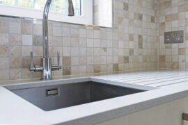 Professional kitchen installation in Arkley featuring a mosaic tiles and a chrome kitchen tap as the main focal points. The design is completed with a quartz worktop and an under mount sink for a cohesive modern finish. Project completed by A Martens Kitchens & Bathrooms Ltd. For a free quote, visit https://amartens.co.uk to discuss your kitchen renovation. Professional kitchen installation in Arkley featuring a mosaic tiles and a chrome kitchen tap as the main focal points.
