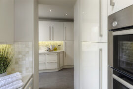 Professional kitchen installation in Arkley featuring a high gloss kitchen and a mosaic tiles as the main focal points. The design is completed with a grey floor tiles for a cohesive modern finish. Project completed by A Martens Kitchens & Bathrooms Ltd. For a free quote, visit https://amartens.co.uk to discuss your kitchen renovation. Professional kitchen installation in Arkley featuring a high gloss kitchen and a mosaic tiles as the main focal points.