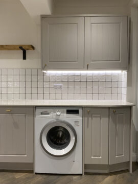 Professional kitchen installation in Totteridge featuring a shaker kitchen and a square tiles as the main focal points. The design is completed with a washing machine and a quartz worktop for a cohesive modern finish. Project completed by A Martens Kitchens & Bathrooms Ltd. For a free quote, visit https://amartens.co.uk to discuss your kitchen renovation. Professional kitchen installation in Totteridge featuring a shaker kitchen and a square tiles as the main focal points