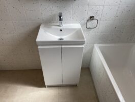 Professional bathroom installation in Arkley featuring a square basin and a speckle porcelain tile as the main focal points. The design is completed with a chrome basin tap and a vanity unit for a cohesive modern finish. Project completed by A Martens Kitchens & Bathrooms Ltd. For a free quote, visit https://amartens.co.uk to discuss your bathroom renovation. Professional bathroom installation in Arkley featuring a square basin and a speckle porcelain tile as the main focal points