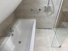 Professional wet room installation in Totteridge featuring a double ended bath and a wet room as the main focal points. The design is completed with a bath tap and a shower screen for a cohesive modern finish. Project completed by A Martens Kitchens & Bathrooms Ltd. For a free quote, visit https://amartens.co.uk to discuss your wet room renovation. Professional wet room installation in Totteridge featuring a double ended bath and a wet room as the main focal points