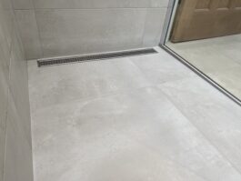 Professional wet room installation in Totteridge featuring a beige tiles and a linear drain as the main focal points. The design is completed with a wet room for a cohesive modern finish. Project completed by A Martens Kitchens & Bathrooms Ltd. For a free quote, visit https://amartens.co.uk to discuss your wet room renovation. Professional wet room installation in Totteridge featuring a beige tiles and a linear drain as the main focal points