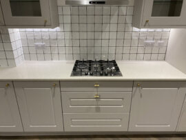 Professional kitchen installation in Totteridge featuring a ceramic tiles and a shaker kitchen as the main focal points. The design is completed with a gas hob and a gold knobs for a cohesive modern finish. Project completed by A Martens Kitchens & Bathrooms Ltd. For a free quote, visit https://amartens.co.uk to discuss your kitchen renovation. Professional kitchen installation in Totteridge featuring a ceramic tiles and a shaker kitchen as the main focal points