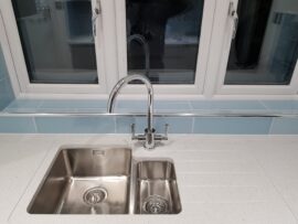 Professional kitchen installation in Mill Hill featuring a chrome kitchen tap and an under mount sink as the main focal points. The design is completed with a corian worktop and a metro tiles for a cohesive modern finish. Project completed by A Martens Kitchens & Bathrooms Ltd. For a free quote, visit https://amartens.co.uk to discuss your kitchen renovation. Professional kitchen installation in Mill Hill featuring a chrome kitchen tap and an under mount sink as the main focal points